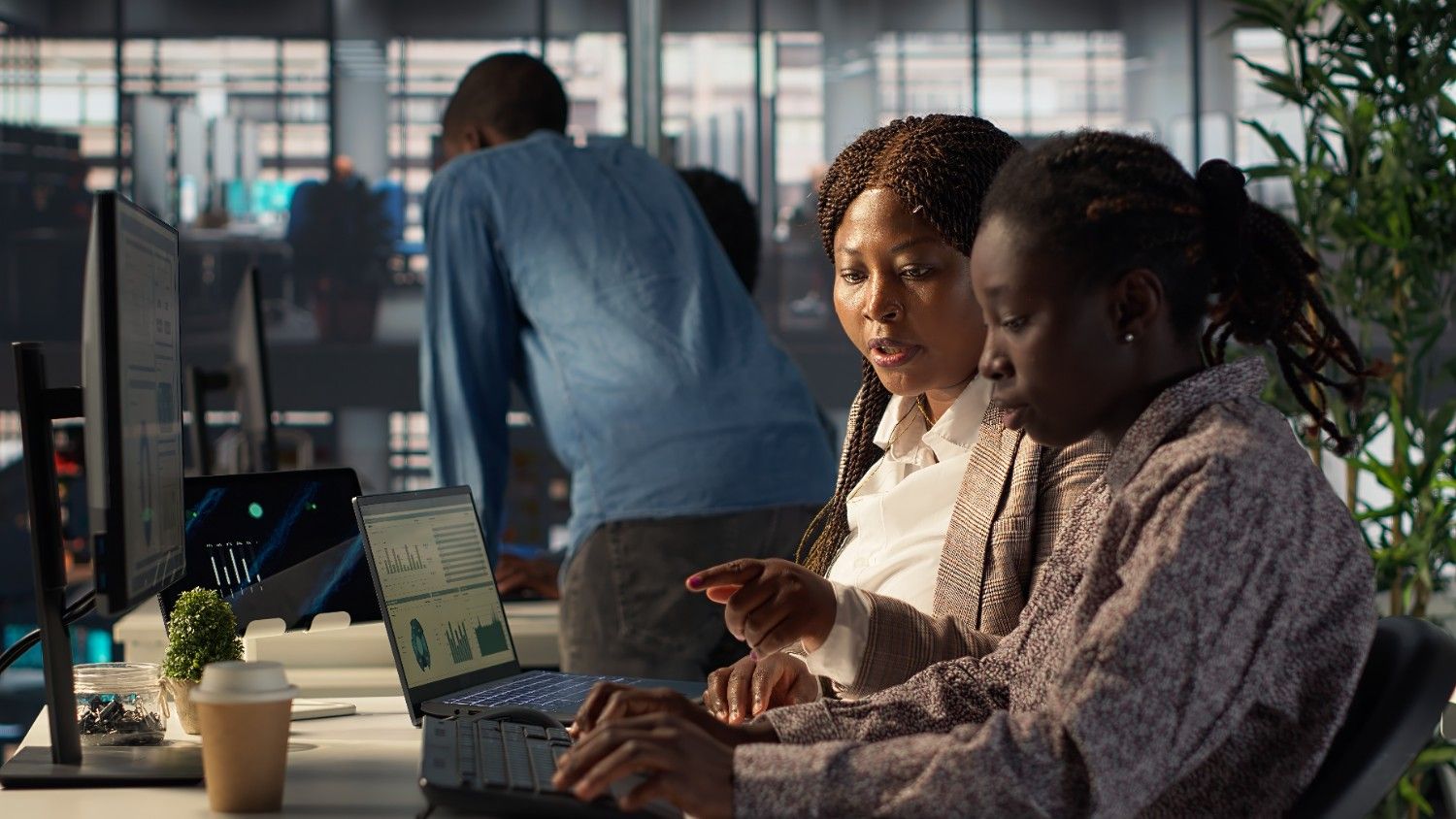 black-business-staff-strategizing-plan-growth-modern-office (1)
